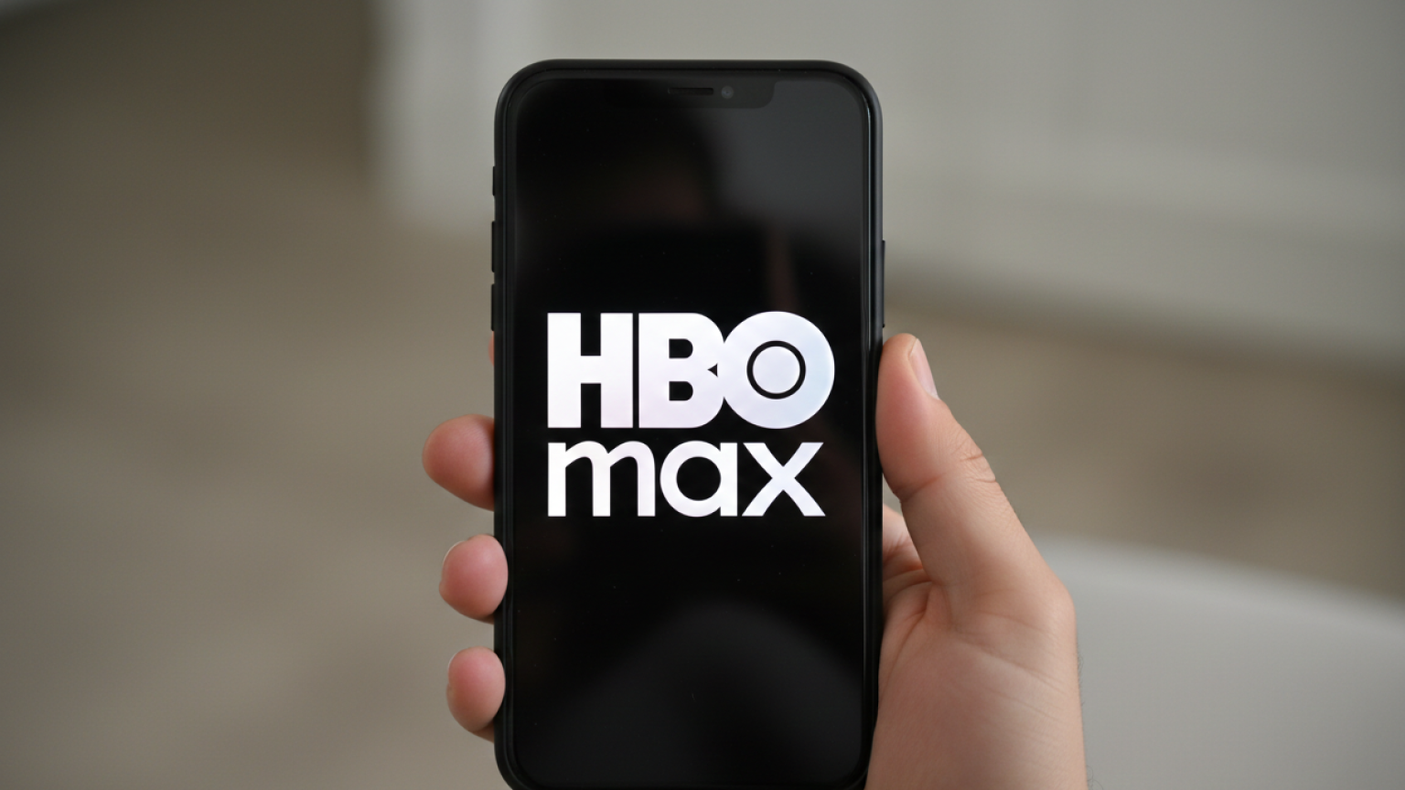 The HBO Max logo on a phone screen.