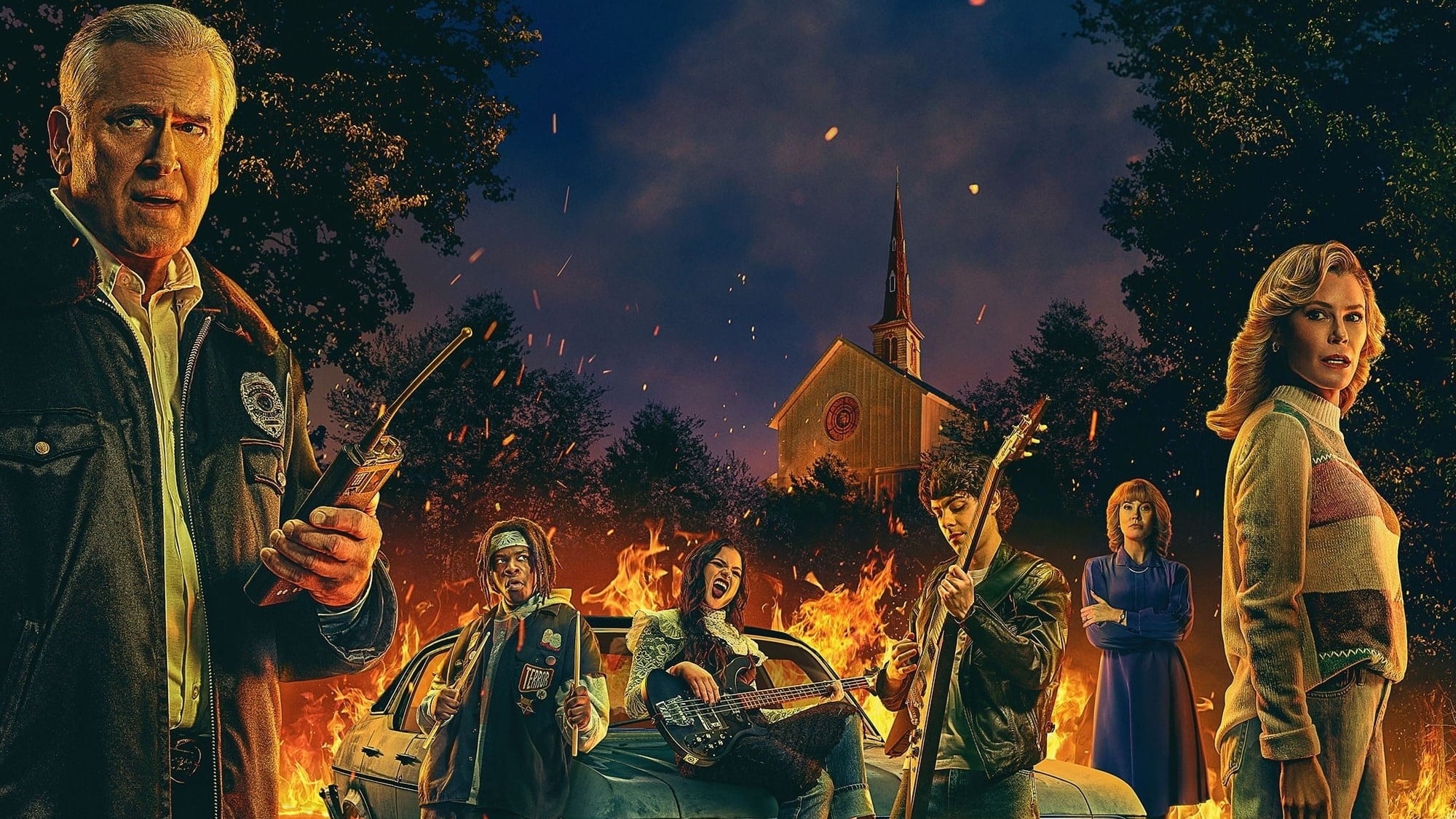 Julie Brown, Bruce Campbell, Emjay Anthony, Chiara Aurelia, and Kezii Curtis lead the cast of the Peacock Original series "Hysteria!," premiering this Friday.