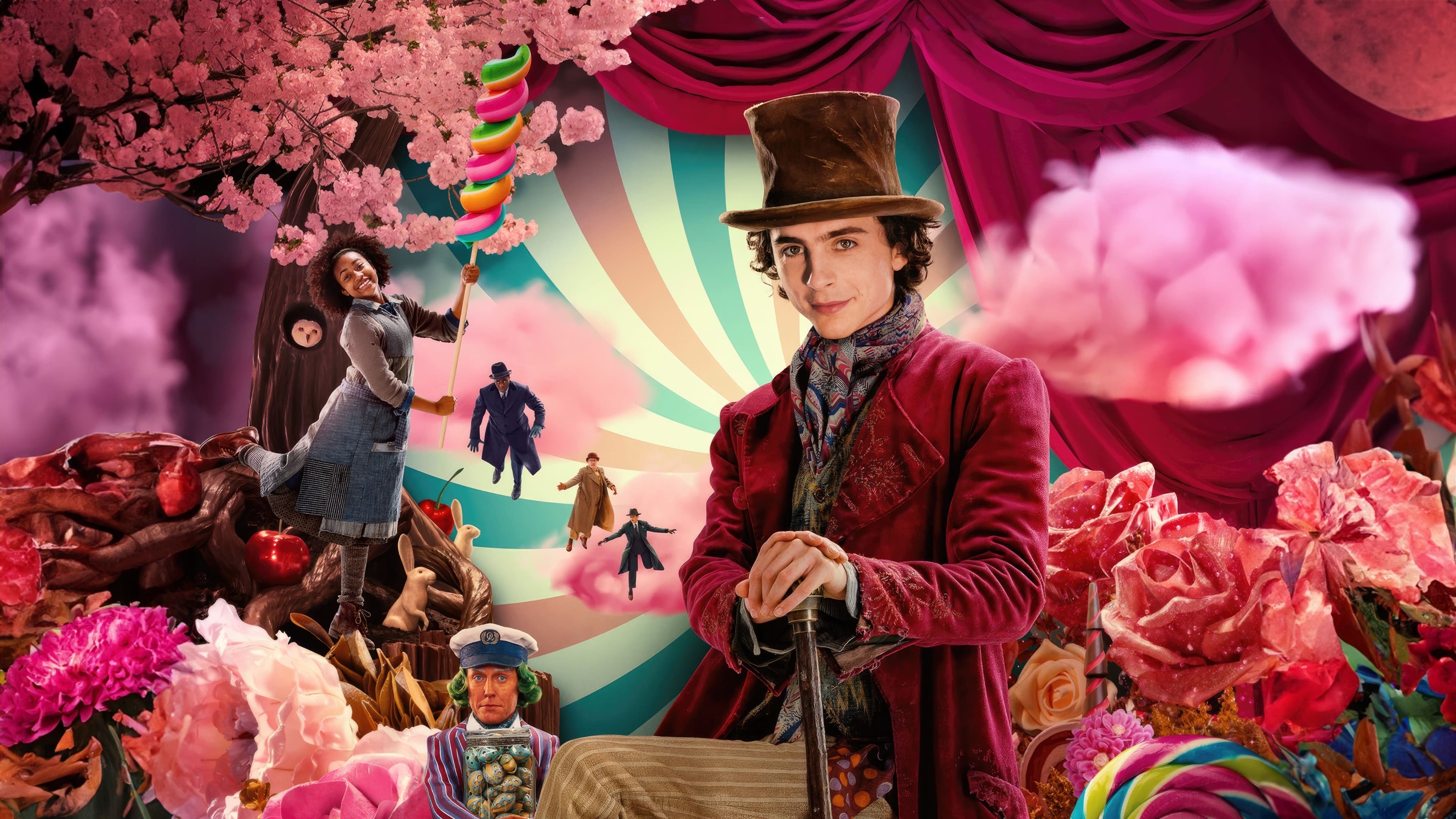 Graphic featuring candy, florals, and the cast of "Wonka," with Timothée Chalamet dressed as Wonka in the center