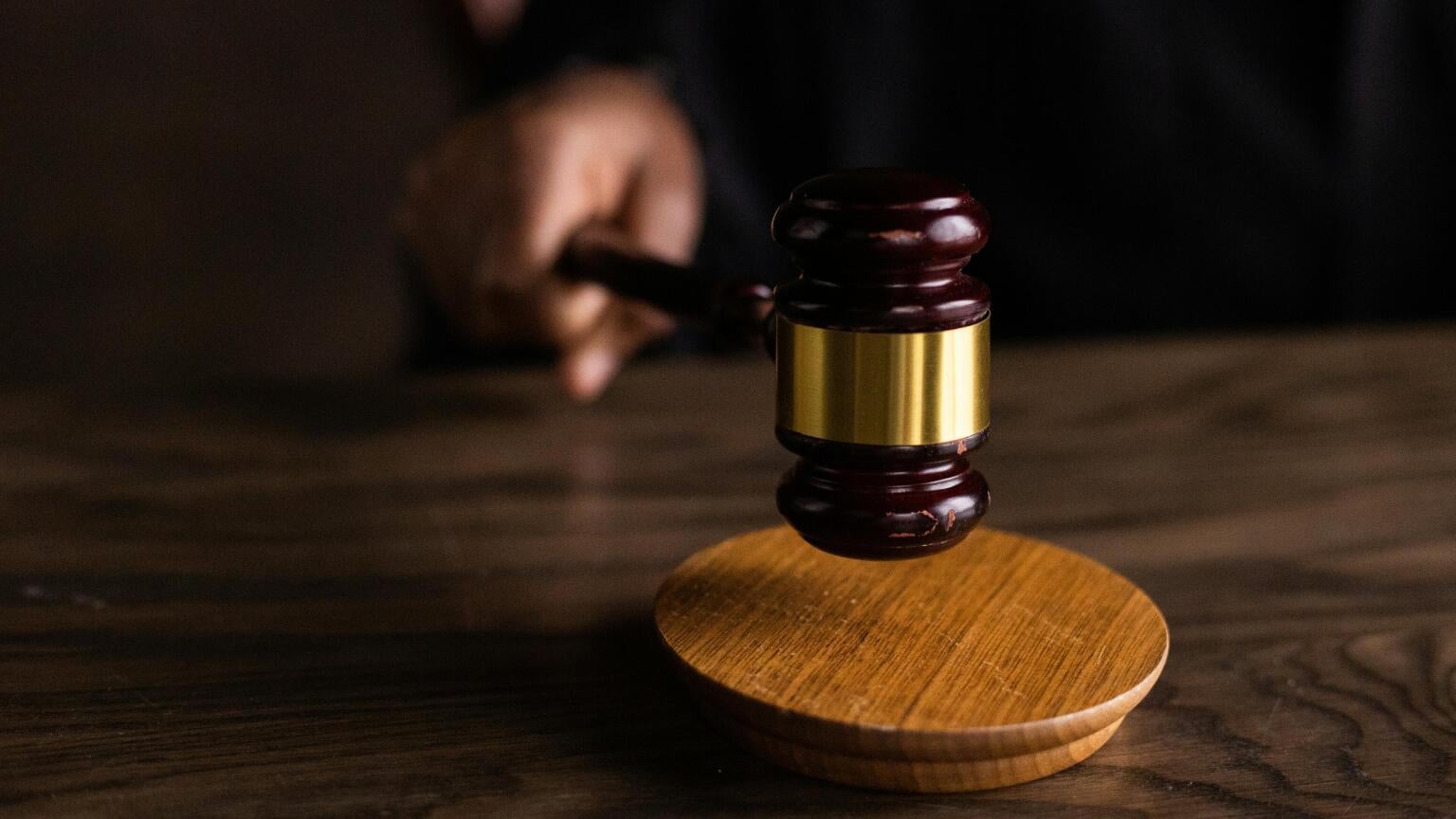 A judge banging their gavel after making a ruling.