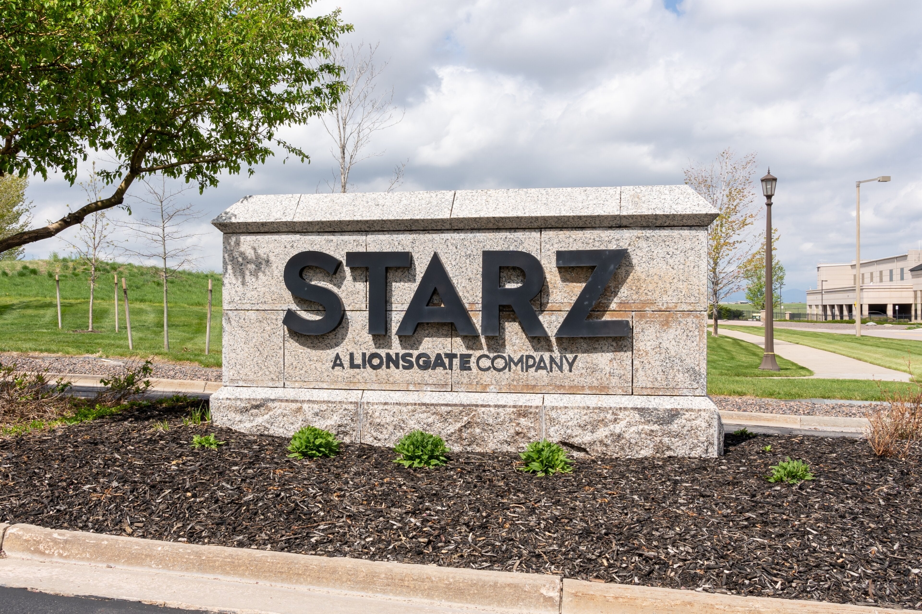 The STARZ sign outside a corporate building, and news regarding its third quarter earnings.