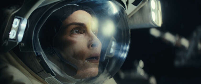 Noomi Rapace in an astronaut helmet in a promotional image for Apple TV+'s 