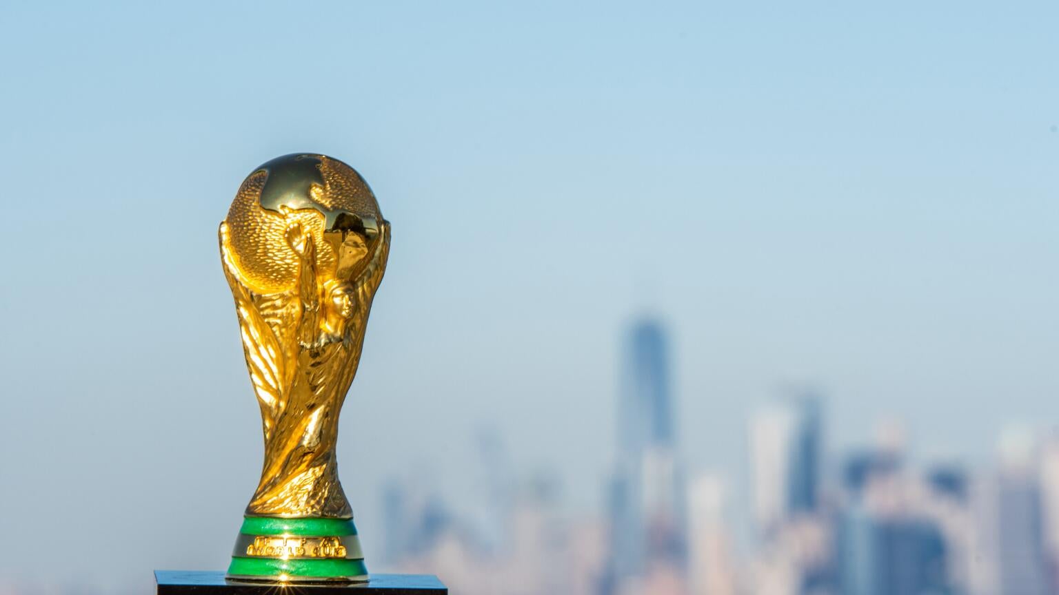 The World Cup trophy in front of the New York skyline, and a story about the tournament's 2026 TV ratings.